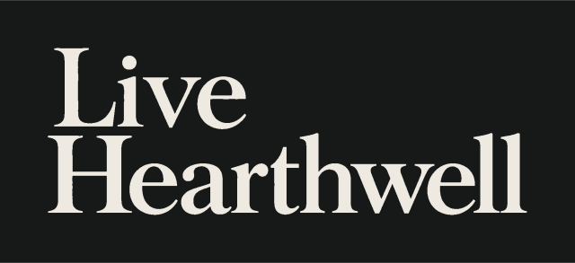 Light on obsidian Live Hearthwell wordmark