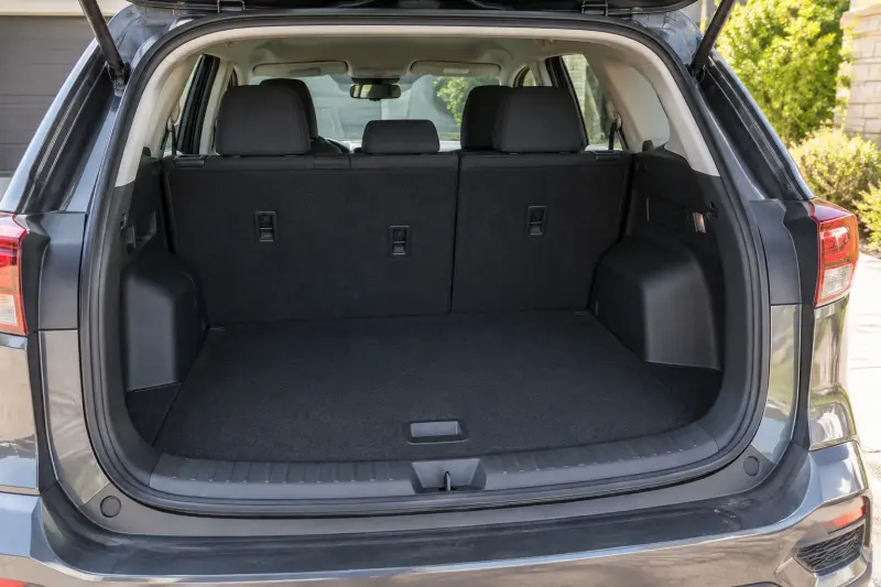 Illustrative empty car load area showing the opening, threshold and interior wheel-arch contours.