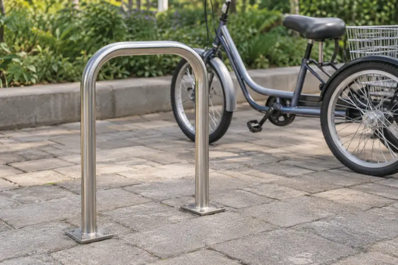 Illustrative empty cycle stand with part of a stationary tricycle visible behind it.