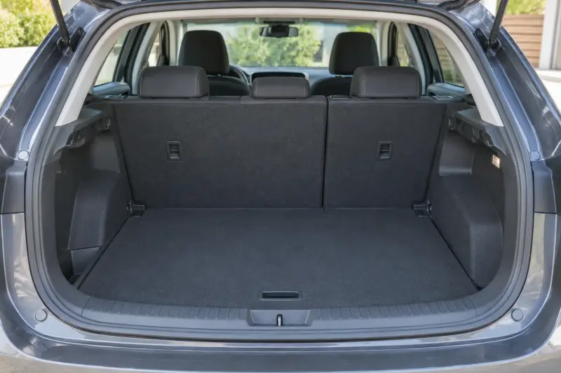 An empty hatchback cargo area with rear seats upright.