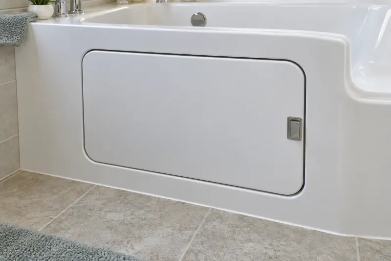 Closed white bath-door panel with a narrow seam and simple latch